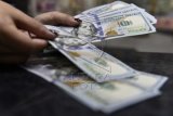 Rupiah melemah menjadi Rp14.012 per dolar AS