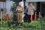 Pjs Bupati Tanah Laut Achmad Sofiani Memimpin Apel Tiga Pilar Kebangsaan, di Halaman Stadion Pertasi Kencana Pelaihari, Jum'at (8/6).Foto:Antaranews Kalsel/Arianto.