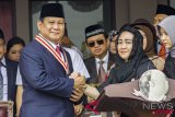 Prabowo-Sandi Upacara Di UBK