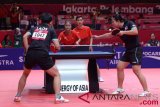 Petenis meja ganda campuran Laos Mosangsinh Sonpasith/Southammavong Thiphakone bertanding melawan pasangan Indonesia M Bima Abdi Negara/Rina Sintya pada babak penyisihan tenis meja ganda campuran Asian Games 2018 di JIExpo Kemayoran, Jakarta, Rabu (29/8/2018). (ANTARA FOTO/INASGOC/Dewi Nurcahyani)