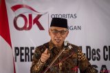 Ketua Dewan Komisioner Otoritas Jasa Keungan (OJK) Wimboh Santoso memberikan sambutan pada Peresmian Badan Usaha Milik Desa (BUMdes)