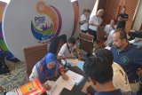 Sejumlah peserta melakukan pendaftaran menjelang Kongres PSSI 2019 di Nusa Dua, Bali, Sabtu (19/1/2019). Kongres tahunan PSSI tersebut akan berlangsung pada Minggu (20/1/2019). ANTARA FOTO/Nyoman Budhiana.