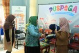 Ketua TP  PKK Hj Ririen Nadjmi Adhani didampingi Kepala Dinas Dalduk KB PMP dan PA Kota Banjarbaru Ir Hj Puspa Kencana MP membuka Sosialisasi Pos Pelayanan Teknologi (Posyantek) yang dilaksanakan Dinas Dalduk KB PMP dan PA Kota Banjarbaru, bertempat di Aula Dinas Dalduk KB PMP dan PA Kota Banjarbaru.Banjarbaru Selasa (19 Februari 2019).Foto Antaranews/hms/f 