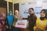 Lipat gandakan kebaikan, BNI Cabang Solok bagikan 250 paket sembako