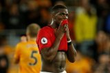 Paul Pogba masih menepi hingga akhir tahun