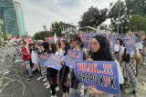 Kenapa pakai topeng untuk berdemo menolak Perppu tentang KPK  ?