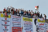 Rakyat Irak turun ke jalan buat protes terbesar sejak kejatuhan Saddam Hussein