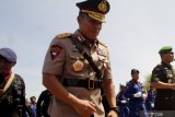 Kupang policeman donates first salary to help corona affected families