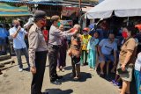 Satgas Binmas Operasi Aman Nusa Polda Sulut sumbang masker kepada warga