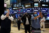 Wall Street naik setelah Fed menjanjikan lebih banyak dukungan ekonomi