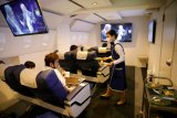 Liburan virtual dari kabin pesawat masih mendarat