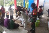 Babinsa-Puskesmas Beoga sosialisasikan cegah COVID-19 dan imunisasi