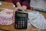 Kurs Rupiah akhir pekan ditutup menguat didorong stimulus fiskal AS