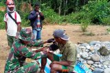 Satgas Yonif 516/CY berikan layanan kesehatan gratis warga perbatasan RI-PNG