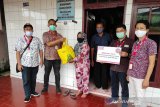 Alfamart salurkan bantuan korban banjir di Manado