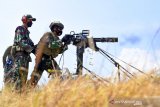 Sejumlah prajurit pasukan khusus Batalyon Intai Amfibi (Taifib) 2 Marinir melakukan latihan menembak senjata mesin otomatis Gatling Gun di Pusat Latihan Pertempuran Korps Marinir 5 Baluran, Situbondo, Jawa Timur. Senin (31/5/2021). Latihan tersebut merupakan bagian dari Latihan Satuan Dasar (LSD) II TW.II Aspek Darat TA. 2021 untuk meningkatkan profesionalisme setiap prajurit Batalyon Intai Amfibi 2 Marinir sehingga siap dalam menjalankan setiap tugas yang diemban baik di darat, laut maupun udara. Antara Jatim/Serma Mar Kuwadi/zk