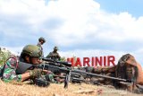 Sejumlah prajurit pasukan khusus Batalyon Intai Amfibi (Taifib) 2 Marinir melakukan latihan menembak Sniper di Pusat Latihan Pertempuran Korps Marinir 5 Baluran, Situbondo, Jawa Timur. Senin (31/5/2021). Latihan tersebut merupakan bagian dari Latihan Satuan Dasar (LSD) II TW.II Aspek Darat TA. 2021 untuk meningkatkan profesionalisme setiap prajurit Batalyon Intai Amfibi 2 Marinir sehingga siap dalam menjalankan setiap tugas yang diemban baik di darat, laut maupun udara. Antara Jatim/Serma Mar Kuwadi/zk