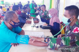 Satgas TNI Yonif 315/Grd bersama Dinkes Mappi vaksinasi 776 warga
