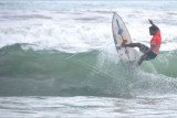 Peselancar Made Joi beraksi saat mengikuti Divisi Open Men Boardriders Qualifying Series di Pantai Legian, Badung, Bali, Minggu (3/10/2021). Kompetisi Boardriders Qualifying Series itu merupakan rangkaian kualifikasi Liga Surfing Indonesia untuk menyeleksi peselancar yang akan mewakili Selancar Ombak Birlian Legian Boardriders Club untuk bertanding dalam putaran final Liga Surfing Indonesia 2021 yang rencananya akan diselenggarakan akhir tahun mendatang. ANTARA FOTO/Fikri Yusuf/nym.