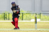 Pemain kriket putri Bali Kadek Winda Prastini memukul bola saat melawan tim kriket putri Kalimantan Timur pada pertandingan final kriket putri T20 PON Papua di Lapangan Kriket, Doyo Baru, Kabupaten Jayapura, Papua, Senin (4/10/2021). Tim Kriket putri Bali berhasil meraih medali emas usai mengalahkan tim Kalimantan Timur dengan skor akhir 97/3 - 96/8. ANTARA FOTO/M Risyal Hidayat/nym.