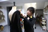 Olimpiade bawa berkah bagi perancang busana seluncur  indah di China