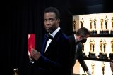 Komedian Chris Rock masih memproses tamparan dari Will Smith di Oscar