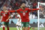 Pemain timnas Maroko Youssef En-Nesyri (19) berselebrasi usai mencetak gol ke gawang Portugal pada pertandingan babak perempat final Piala Dunia Qatar 2022 di Stadion Al Thumama, Doha, Qatar, Sabtu (10/12/2022). Skor sementara hingga menit ke-60, Maroko memimpin 1-0 atas Portugal. ANTARA FOTO/REUTERS/Carl Recine/wsj.