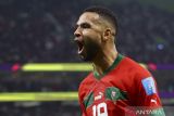 Pemain timnas Maroko Youssef En-Nesyri (19) berselebrasi usai mencetak gol ke gawang Portugal pada pertandingan babak perempat final Piala Dunia Qatar 2022 di Stadion Al Thumama, Doha, Qatar, Sabtu (10/12/2022). Skor sementara hingga menit ke-60, Maroko memimpin 1-0 atas Portugal. ANTARA FOTO/REUTERS/Carl Recine/wsj.