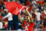 Pemain timnas Maroko Yahia Attiyat Allah berselebrasi usai menang bertanding melawan Portugal pada babak perempat final Piala Dunia Qatar 2022 di Stadion Al Thumama, Doha, Qatar, Sabtu (10/12/2022). Portugal tersingkir dari Piala Dunia 2022 usai keok oleh Maroko 0-1. ANTARA FOTO/REUTERS/Suhaib Salem/wsj.