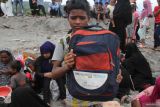 Sejumlah warga Rohingnya terdampar di Desa Lampanah Leugah, Kecamatan Seulimeuem, Aceh Besar, Kamis (16/2/2023). Jumlah imigran 62 orang terdiri dari 21 perempuan dewasa, 23 laki dewasa, dan anak-anak 18 orang. Antara Aceh/Ampelsa
