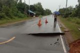 Hujan deras, Jalan menuju Pulau Penyangga amblas