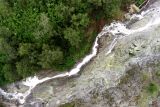 Foto udara aliran air asam belerang di Geosite Kali Pait, Bondowoso, Jawa Timur, Selasa (30/5/2023). Air terjun Kalipait yang teraliri air asam belerang danau kawah Ijen tersebut merupakan salah satu dari geosite yang berada di kasawan Ijen Geopark yang baru saja terdaftar sebagai anggota Unesco Global Geopark (UGG). Antara Jatim/Budi Candra Setya/zk.