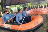 Peringati Bulan K3 Nasional bersama BPBD Padang PLN latih personil tanggap darurat banjir