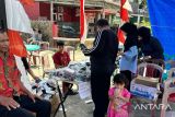 Pemilih di TPS 10 Banda Gadang dapat casing telepon genggam (Video)
