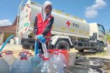 Tim Satgana PMI  Grobogan distribusikan air bersih ke lokasi banjir