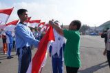 Peringatan HANI 2024 di Padang Panjang bagikan 10 juta bendera