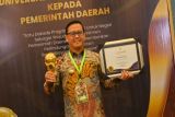 Pj Bupati Banyuasin terima UHC Award