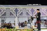 Presiden Joko Widodo menyampaikan sambutan saat membuka Musabaqah Tilawatil Qur'an (MTQ) Nasional ke-30 Tahun 2024 di Stadion Gelora Kadrie Oening, Samarinda, Kalimantan Timur, Minggu (8/9/2024). MTQ Nasional ke-30 bertemakan Mewujudkan Masyarakat Cinta Al-Quran untuk Bangsa yang Bermartabat di Bumi Nusantara itu diikuti 1.998 peserta terdiri dari 1.567 peserta inti dan 431 cadangan dari 35 provinsi yang akan mengikuti delapan cabang perlombaan. Antara Kaltim/M Risyal Hidayat