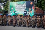 Anggota Barisan Ansor Serbaguna (Banser) mengikuti apel Hari Kesaktian Pancasila di parkir timur GOR Delta Sidoarjo, Jawa Timur, Selasa (1/10/2024). Apel yang ikuti 10.000 anggota banser dengan tema Mengawal Kepimimpinan Indonesia Kedepan tersebut sebagai bentuk komitmen GP Ansor dalam menjaga Pancasila kebhinekaan keagamaan dan kebangsaan serta menjaga persatuan dan kesatuan bangsa. Antara Jatim/Umarul Faruq