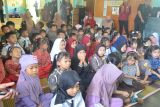 Sejumlah anak-anak PAUD mengikuti kegiatan New Posyandu mengunakan seragam profesi pada kegiatan Bunda PAUD Binaan DWP Kalbar di TK 1 Pertiwi, di Pontianak, Kalimantan Barat, Kamis (28/11/2024). Kegiatan ini merupakan konsep dari New Posyandu yang termasuk bagian dari enam Standar Pelayanan Minimal (SPM) salah satunya bidang Pendidikan, sesuai Permendagri No.13 Tahun 2024 tentang Posyandu. ANTARA/Kristian Jonathan