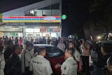 Rekonstruksi titik pertama penembakan bos rental depan Indomaret