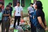 Inovasi pengolahan sampah organik dan anorganik oleh mahasiswa KKN Unila di Desa Priangan Baru