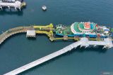 Foto udara suasana bongkar muat kendaraan diatas kapal ferry di Pelabuhan Ketapang, Banyuwangi, Jawa Timur, Jumat (14/3/2025). PT ASDP Indonesia Ferry akan menutup sementara Pelabuhan Ketapang dan Gilimanuk selama Hari Raya Nyepi 2025 yang berbarengan dengan puncak arus mudik lebaran. ANTARA Jatim/Budi Candra Setya/mas.