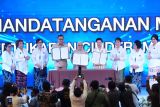 KemenP2MI, KPPPA melakukan tandatangan MoU sosialisasi keberangkatan PMI prosedural