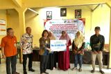 Bupati Banyumas serahkan santunan dan kartu BPJS Ketenagakerjaan untuk penderes