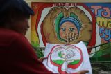 Lomba Mural HUT RI di Aceh. Seniman menyelesaikan pembuatan mural bertema, 