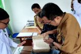 Dinas Kearsipan dan Perpustakaan Barut terima Al Quran tulisan tangan karya ulama lokal