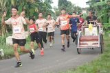 Peserta mengikuti gelaran lari santai (fun run) bertajuk 