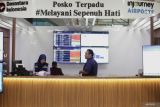Petugas berjaga di posko terpadu Bandara Internasional Juanda Surabaya di Sidoarjo, Jawa Timur, Minggu (4/1/2026). Pengelola Bandara Juanda mencatat, selama pelaksanaan Posko Terpadu Angkutan Natal 2025 dan Tahun Baru 2026 per 3 Januari telah melayani sekitar 817.000 penumpang dan 5.600 an pergerakan pesawat. ANTARA Jatim/Umarul Faruq/mas.