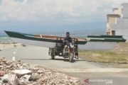 Mengangku perahu dengan montor